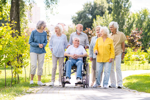 Group of seniors enjoying a stroll in the garden