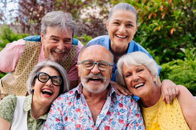 Group of smiling residents outdoors