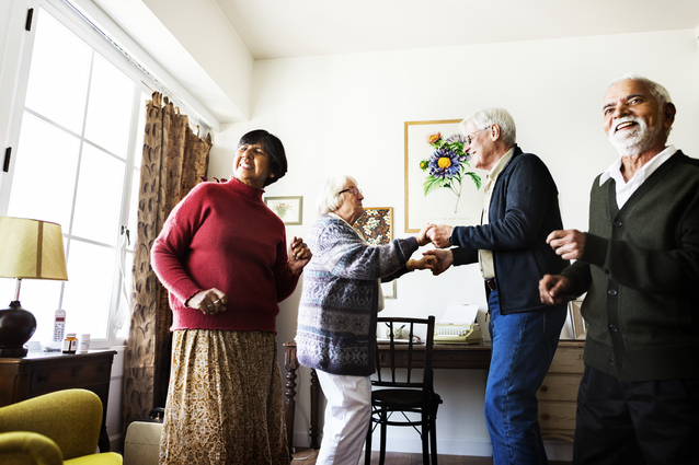 Residents joyfully dancing in a communal area