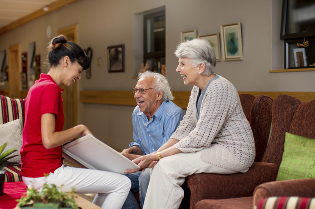 Residents and staff engaged in a conversation.