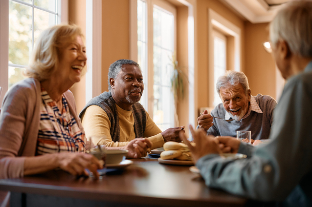 Residents sharing a meal and laughter together