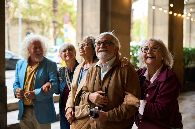 Group of smiling seniors enjoying a moment together.