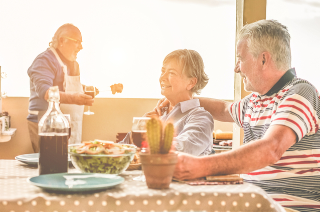 Residents enjoying a meal together in a communal space.