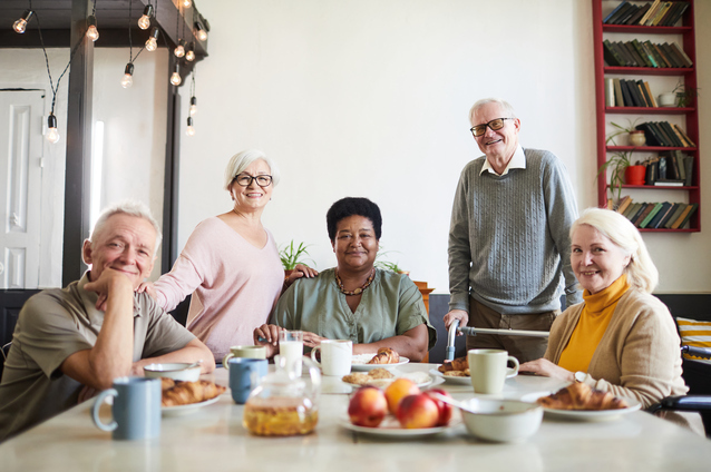 Group of residents enjoying breakfast together.
