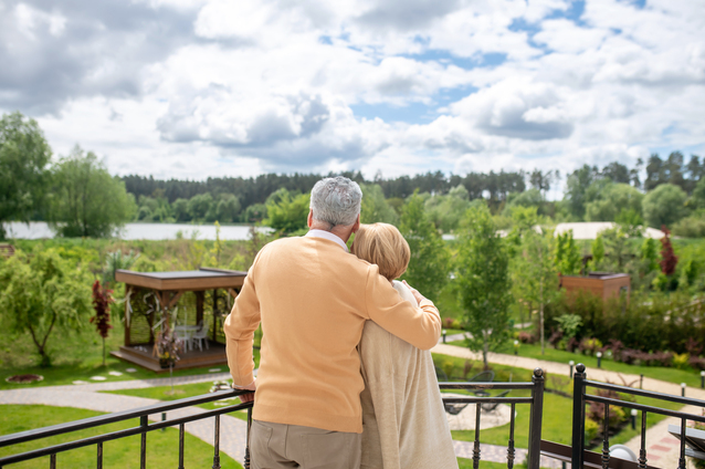 Couple enjoying a scenic outdoor view in a garden