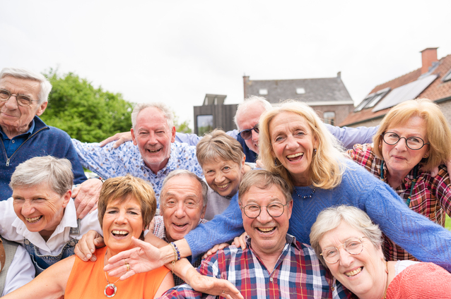 Group of seniors joyfully posing outdoors