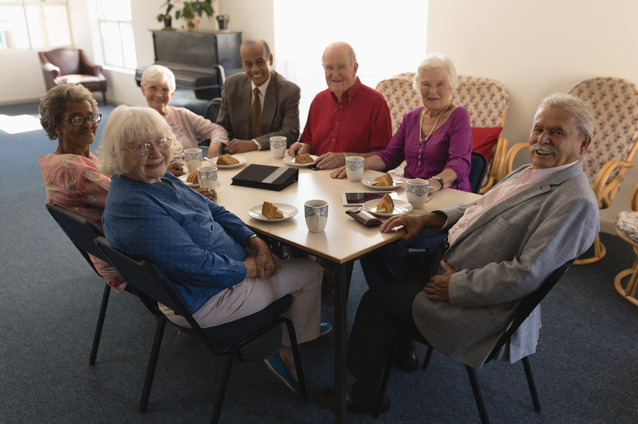 Group of residents enjoying refreshments together