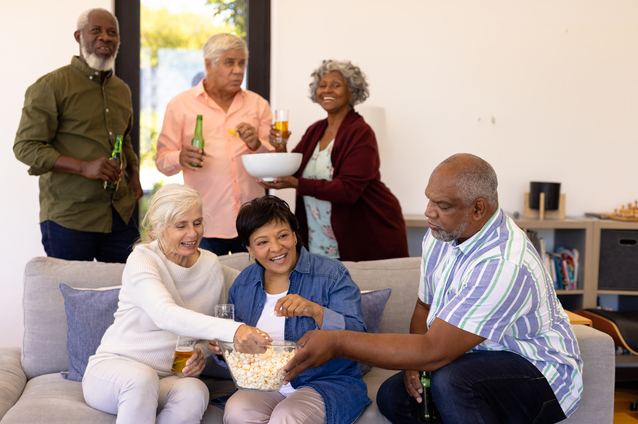 Residents enjoying a social gathering with snacks.