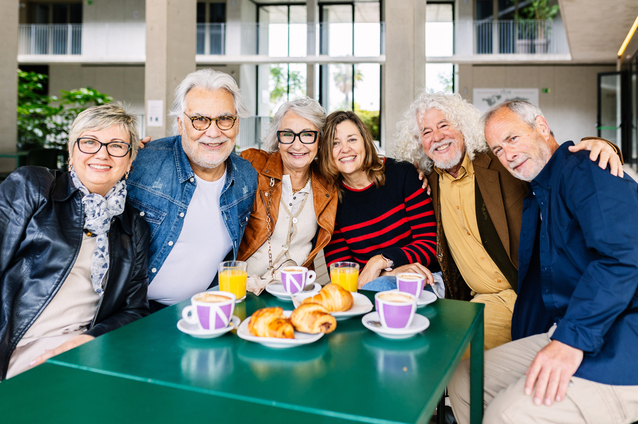 Seniors enjoying breakfast together in a common area