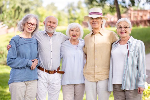 A group of smiling seniors outdoors