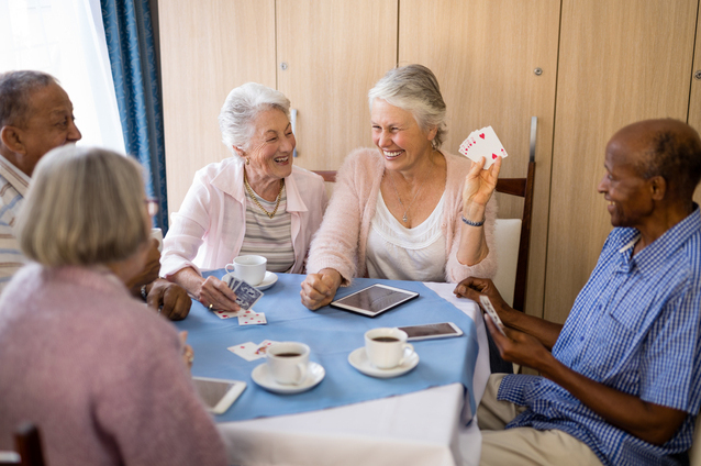 Residents engaged in a fun card game