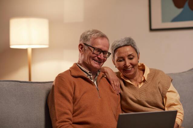 Two seniors happily sharing a moment together