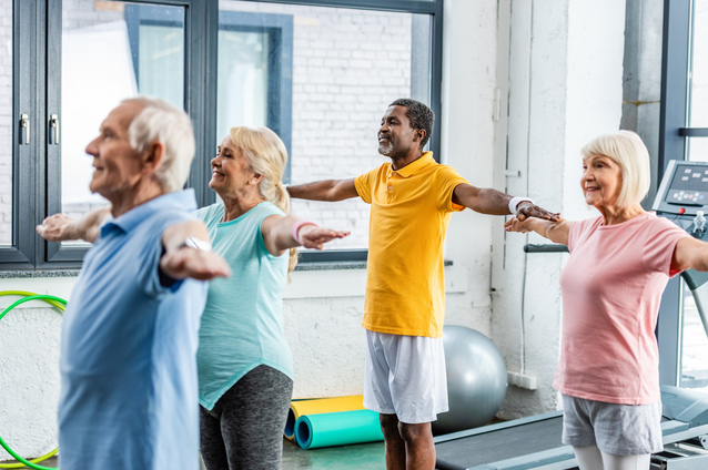 Seniors participating in a group exercise class