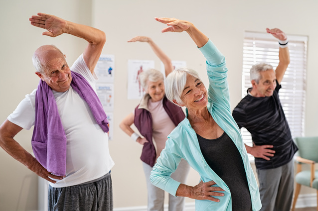 Seniors participating in an exercise class together.