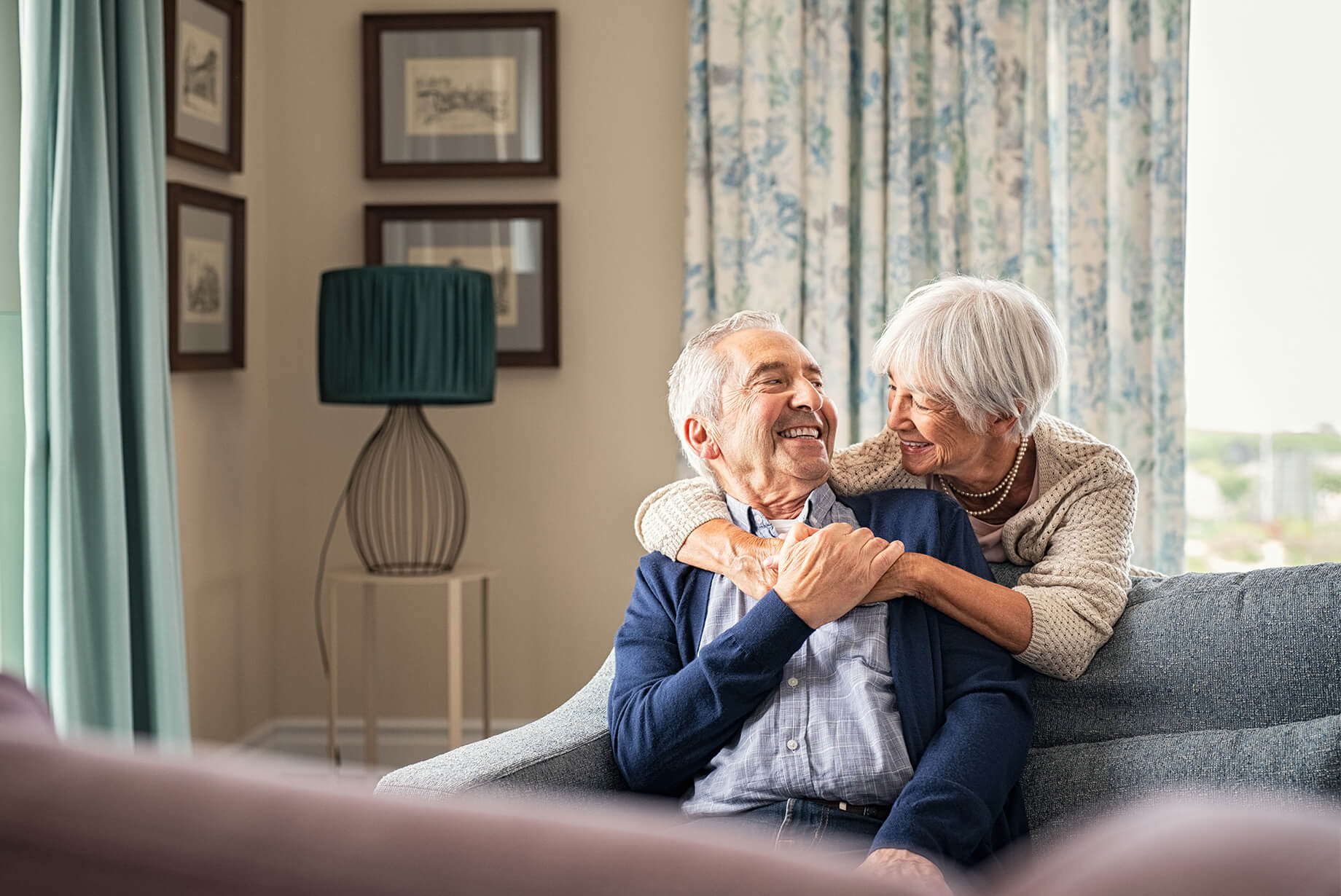 Happy elderly couple in a cozy living room