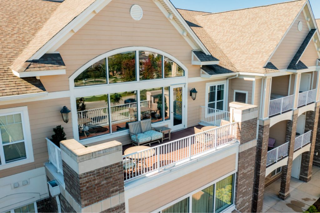 Aerial view of a residential balcony with outdoor seating.
