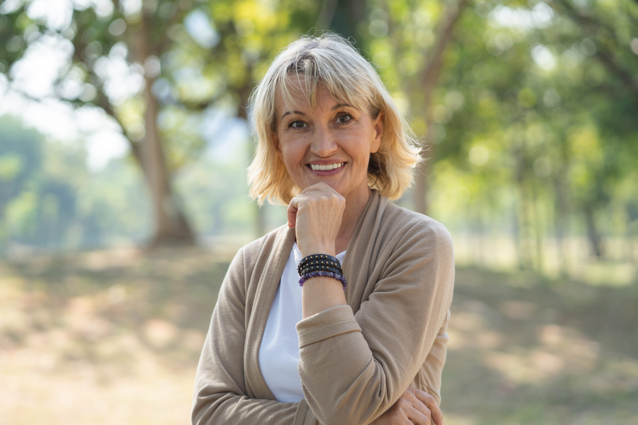Smiling woman in an outdoor park setting