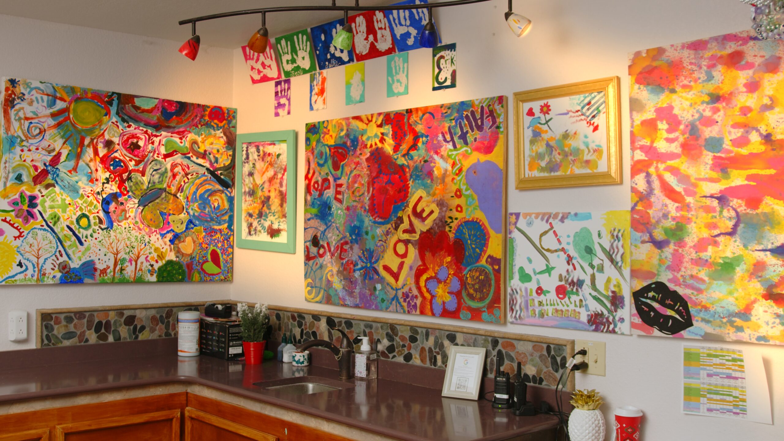 Colorful art displays in a community space.