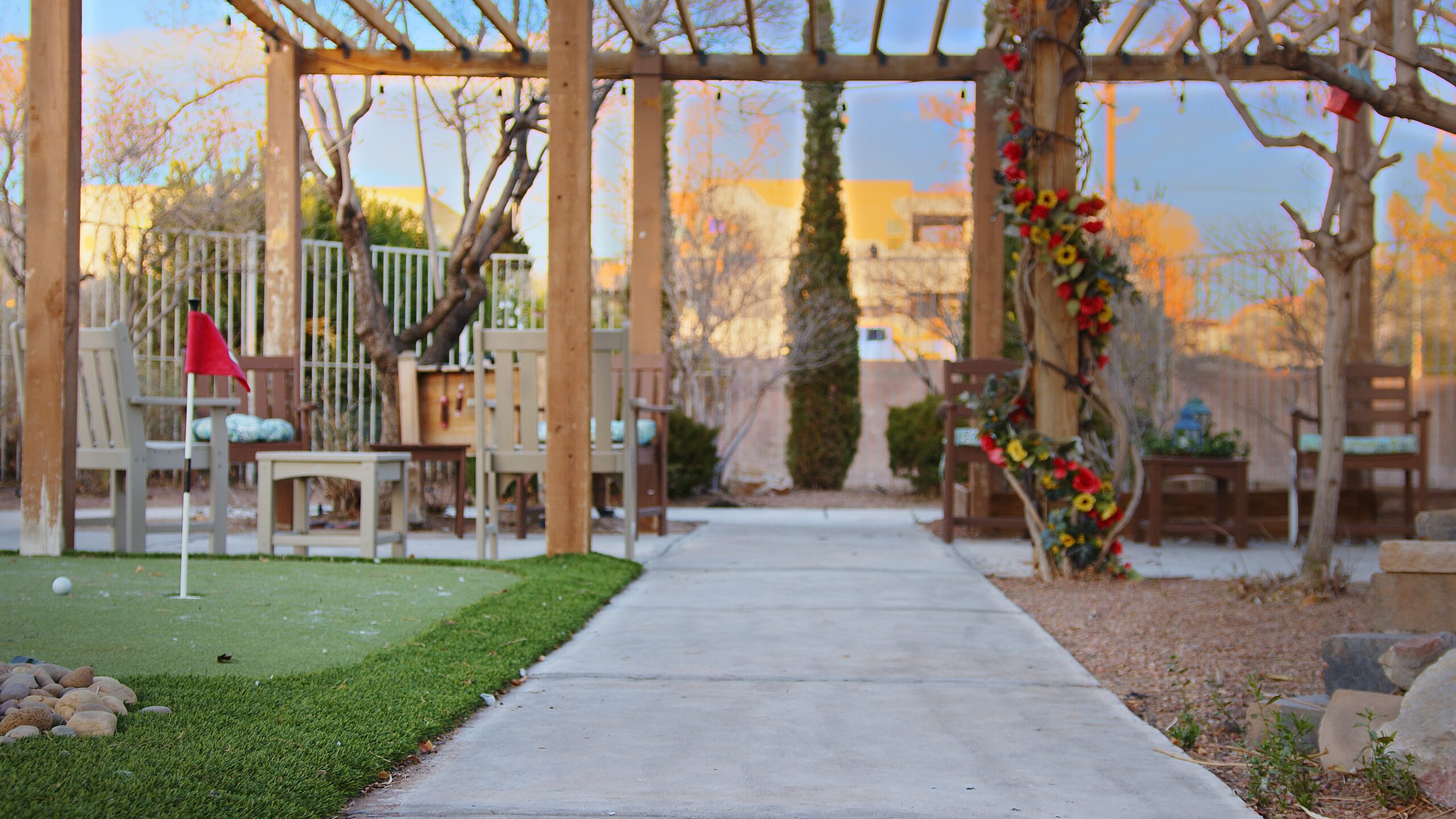 Outdoor garden area with seating and decorations.