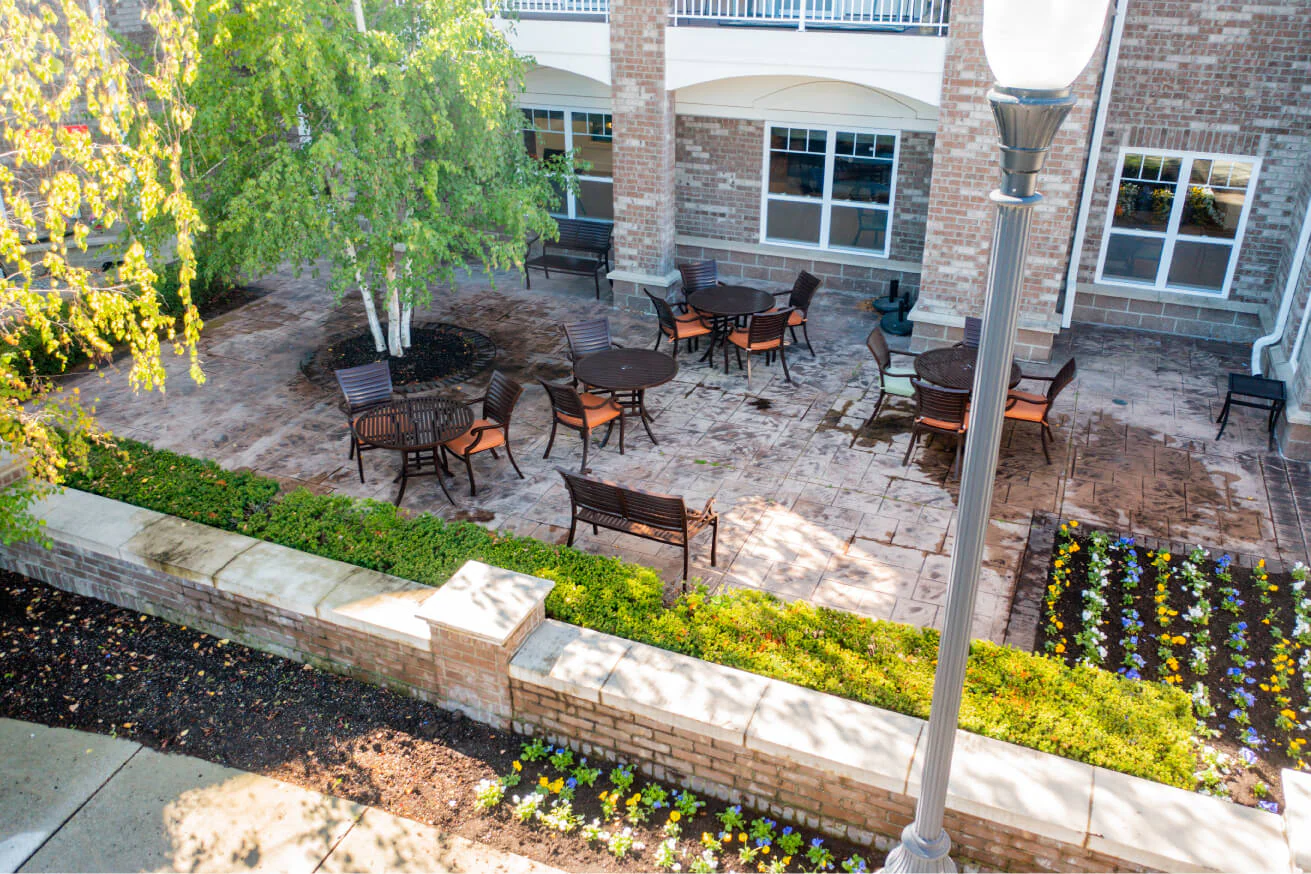 Outdoor patio area with seating in a garden.