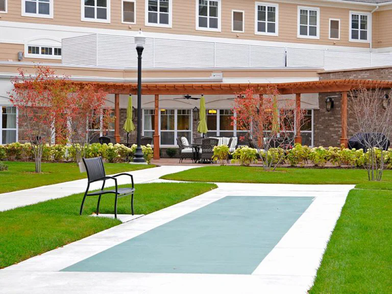 Outdoor seating area with benches and gardens