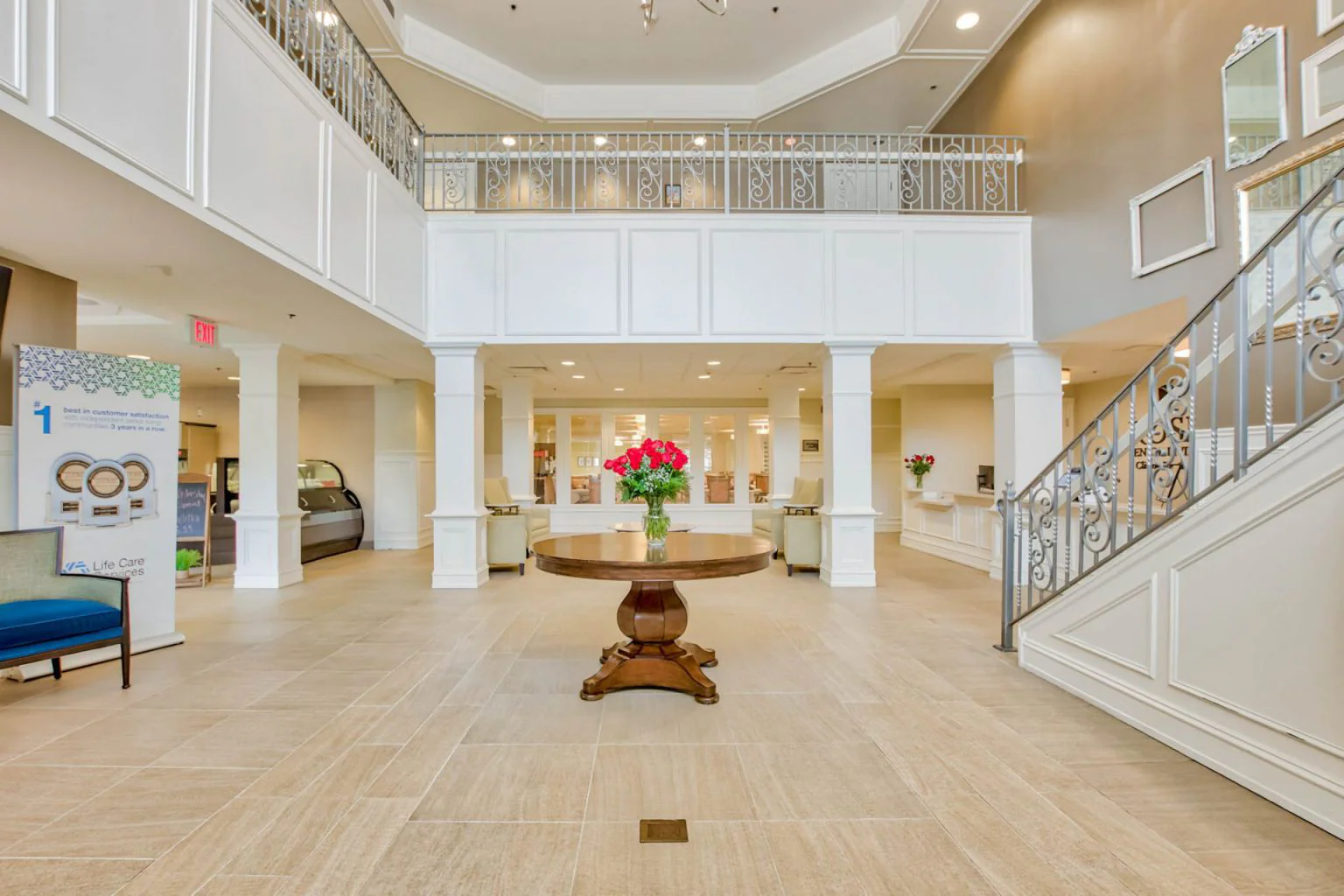 Spacious lobby area with floral centerpiece and seating