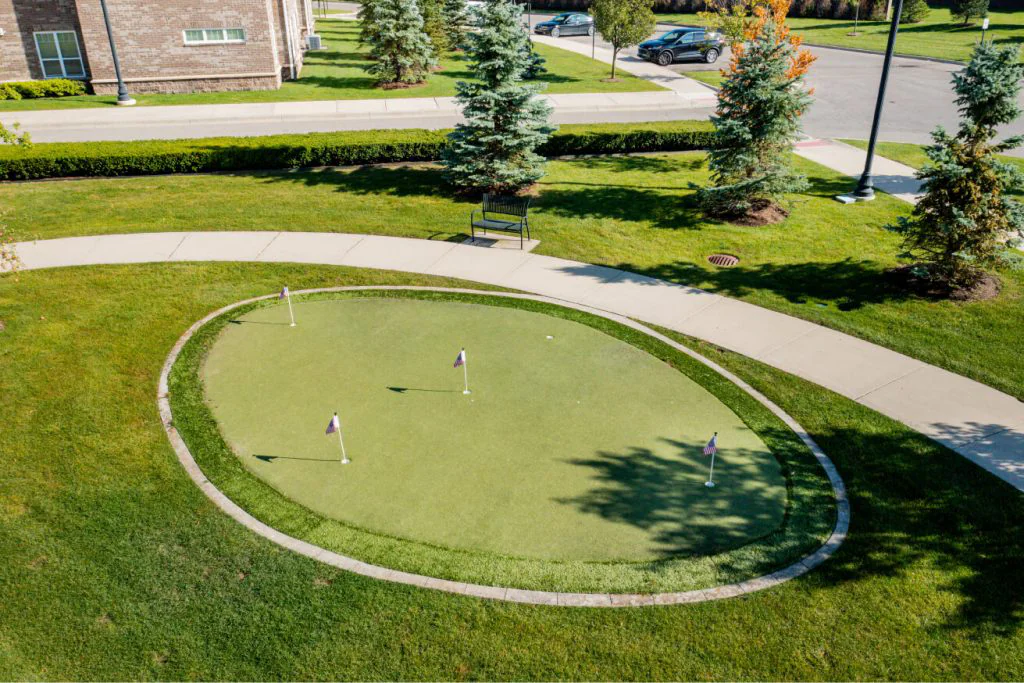 Outdoor putting green in a landscaped area
