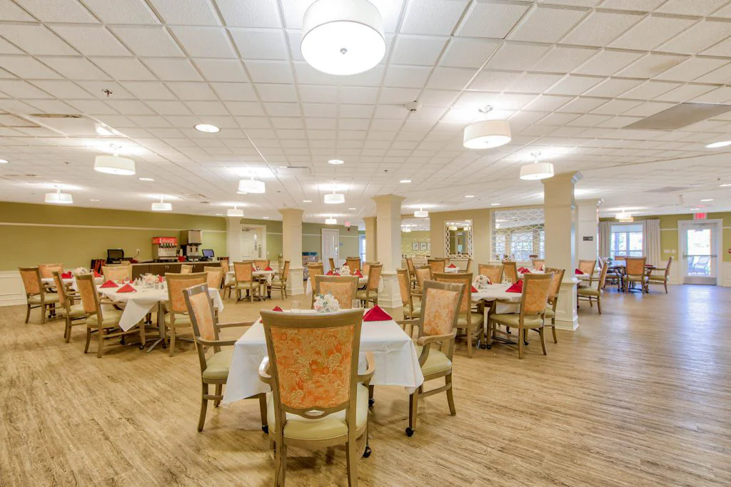 Dining room with neatly set tables and chairs