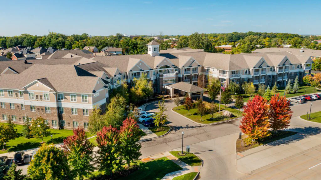 Aerial view of Rose Senior Living facility with gardens.