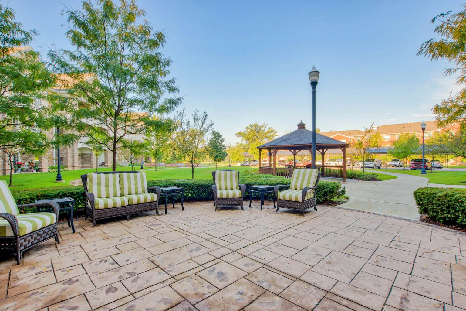 Outdoor seating area with gazebo and manicured lawns