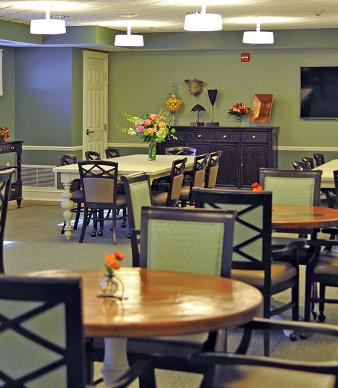 Dining area with tables and floral arrangement