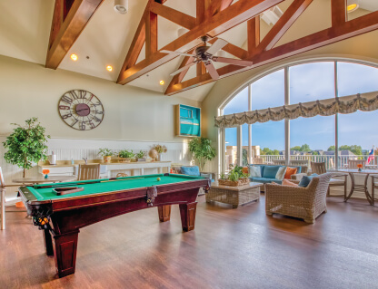 Interior common area with a pool table and seating