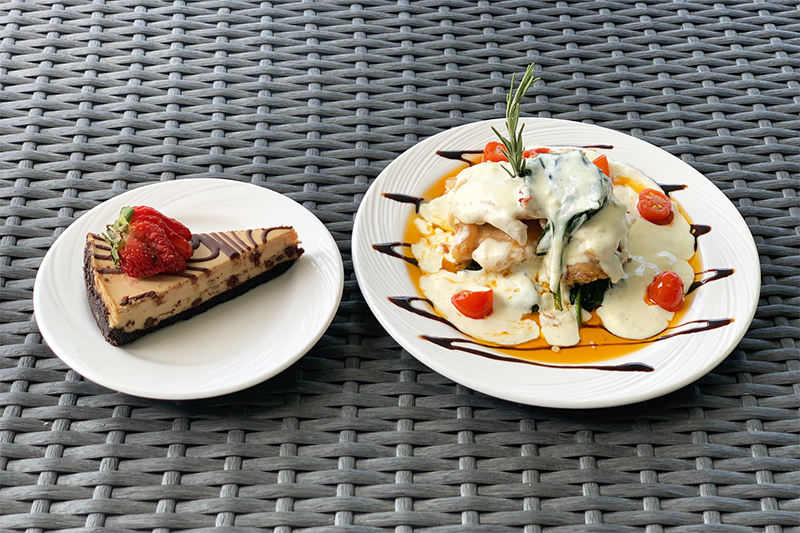 A plate of food with a dessert on the side