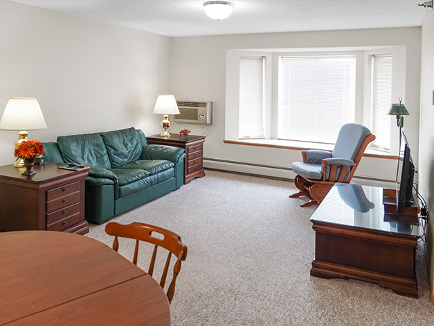 Cozy living area in a resident unit with furniture