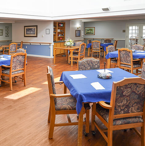 Bright dining room with blue tables and chairs