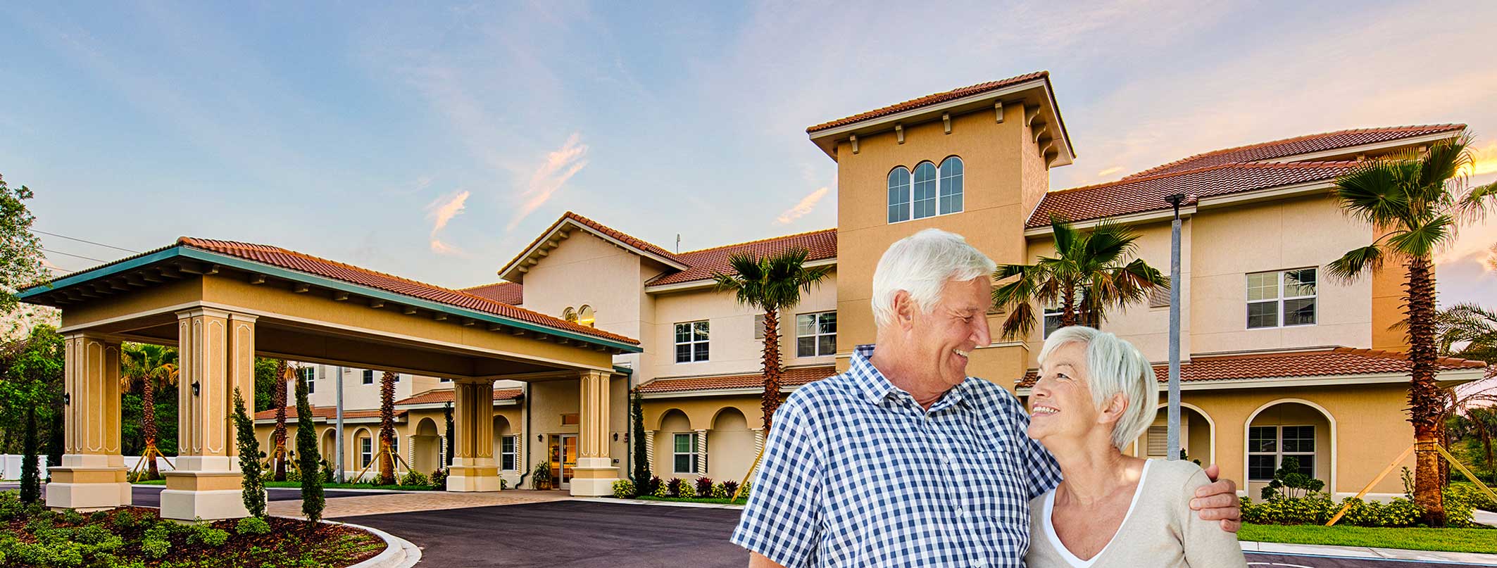 Couple smiling together outside the facility