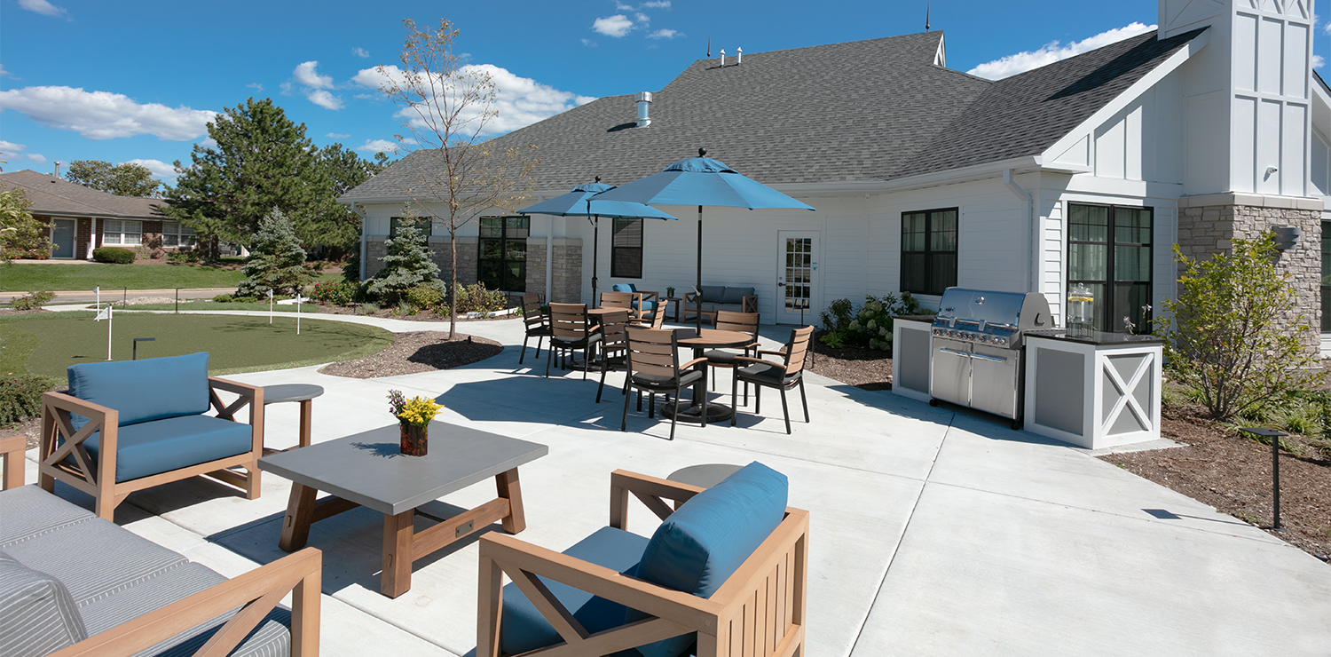 Outdoor patio area with seating and umbrellas