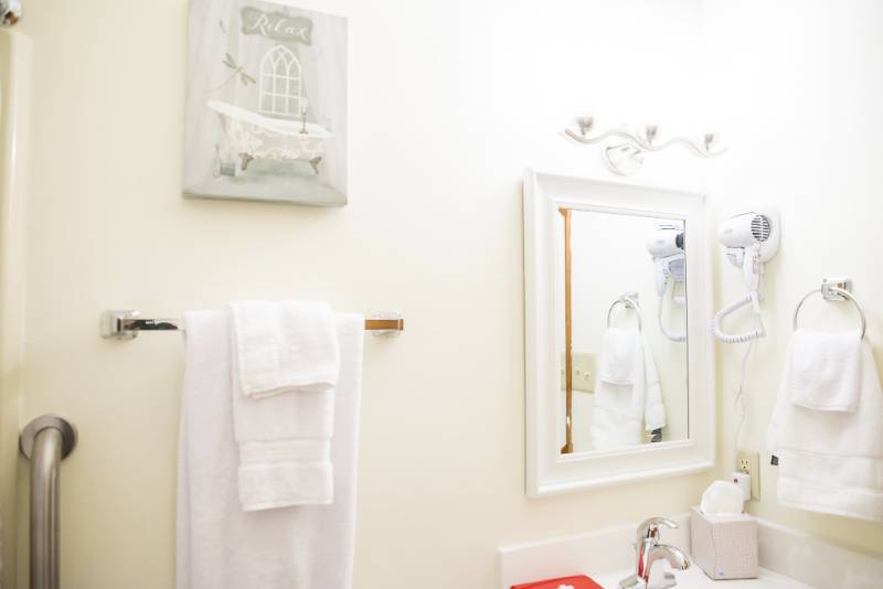 Bright, clean bathroom with fresh towels