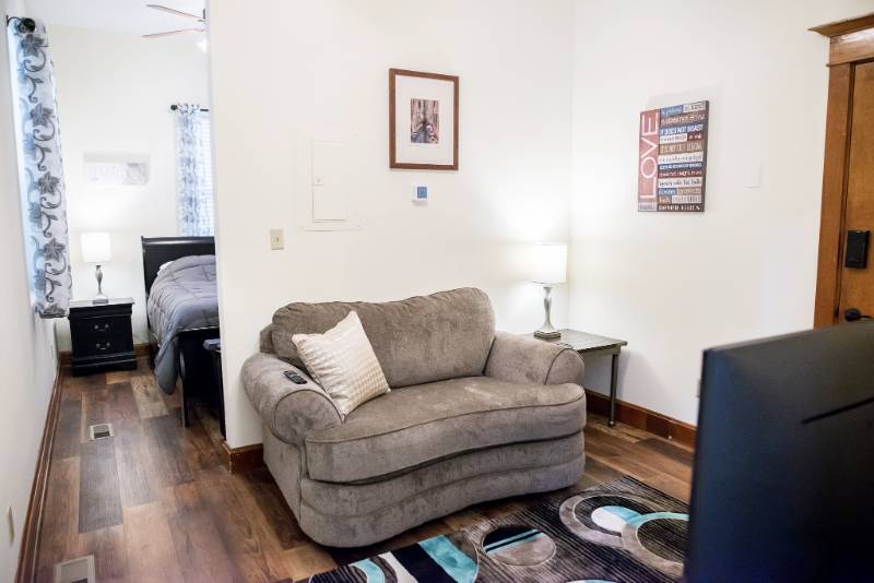 Cozy living area with a couch and lamp