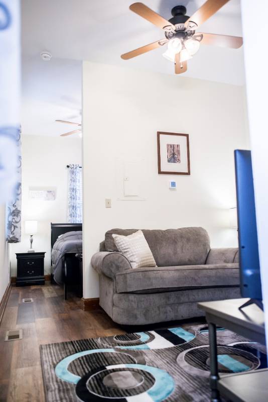 Cozy resident room with a couch and bed