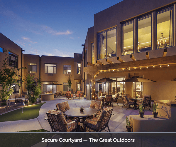 Outdoor courtyard with seating and evening lighting