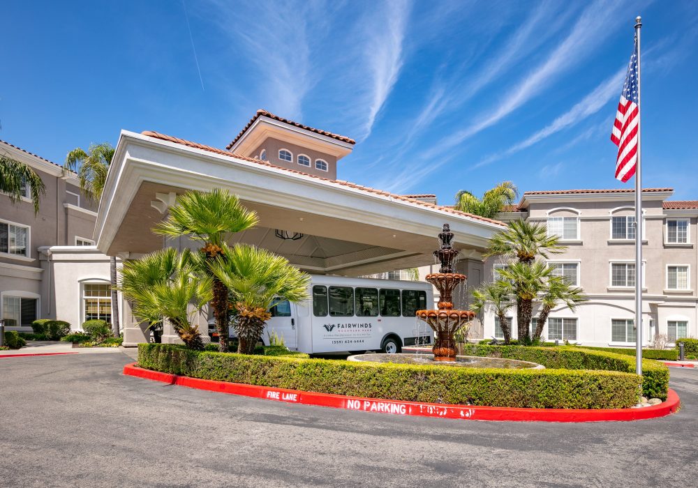 Front entrance of Fairwinds Woodward Park with vehicle