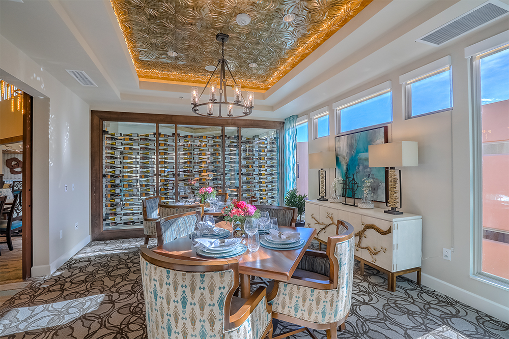Elegant dining room with a decorative ceiling and wine storage