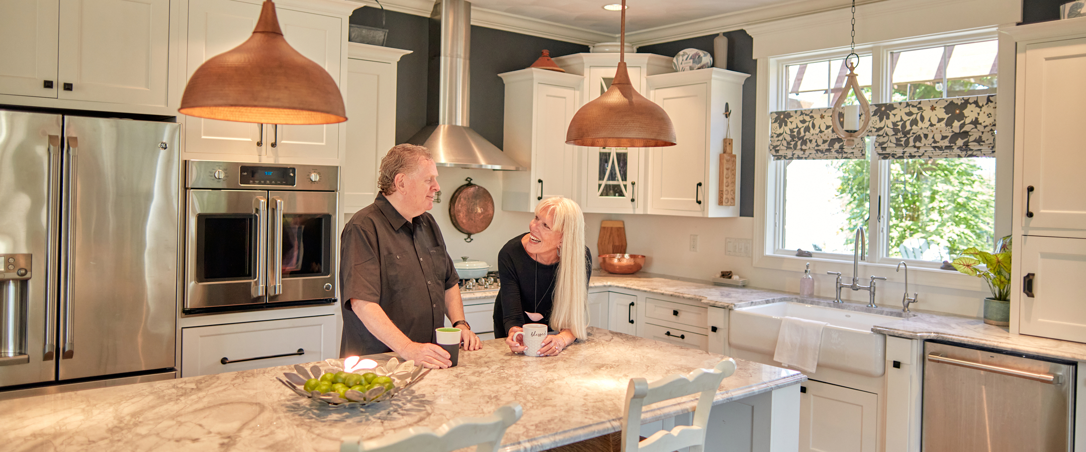 Couple enjoying coffee in a modern kitchen