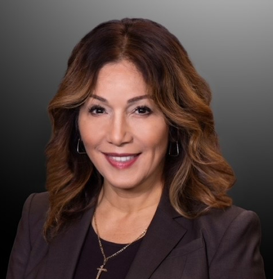 A professional portrait of a smiling woman