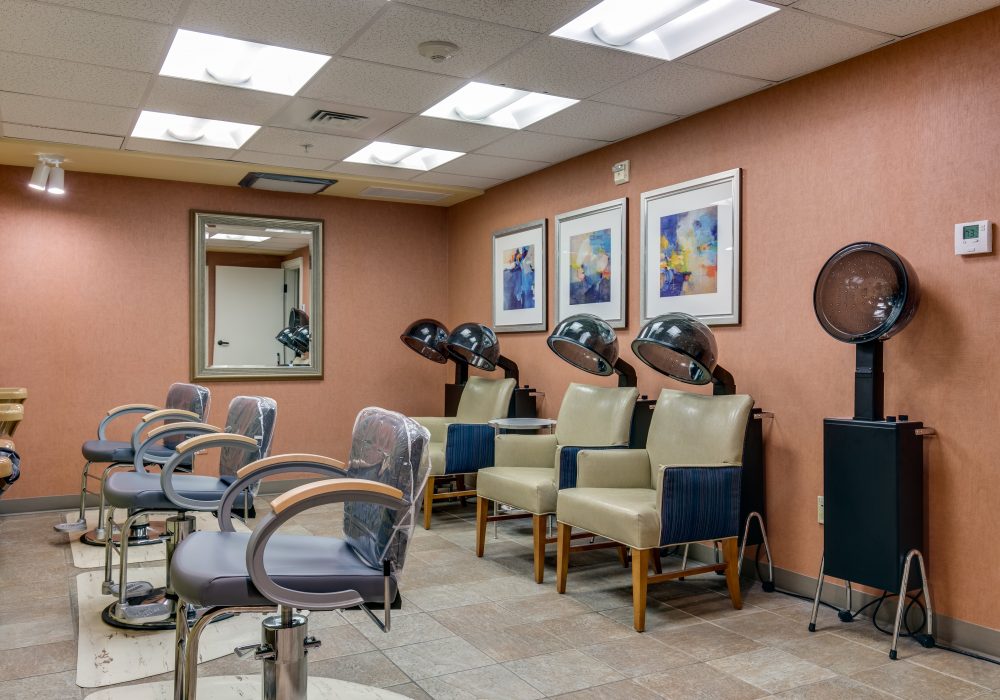 Interior view of a beauty salon with styling stations