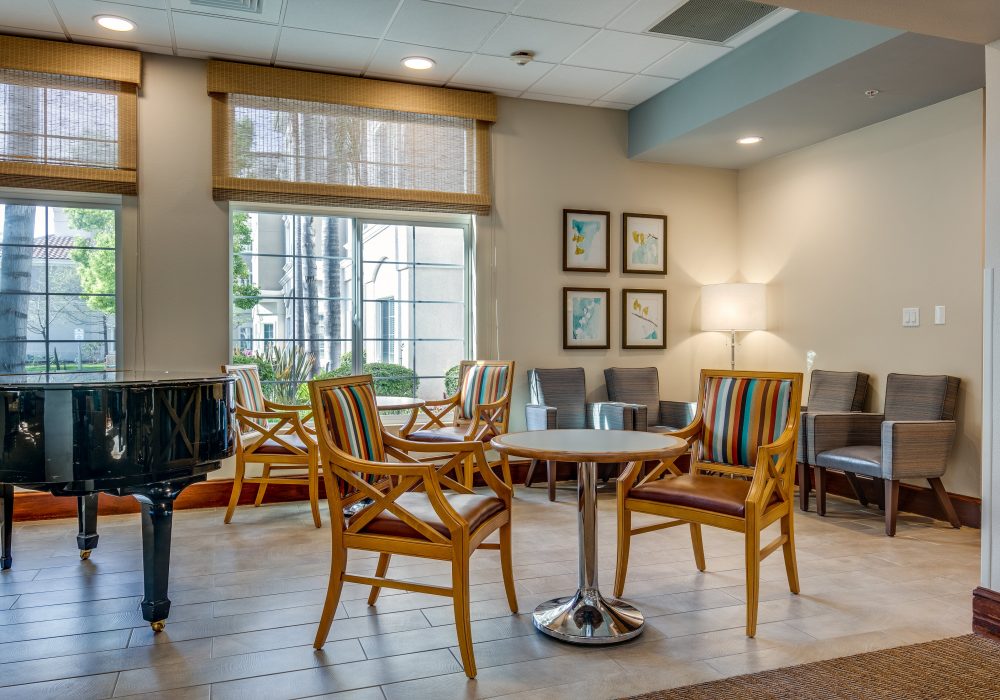 Bright common area with seating and windows