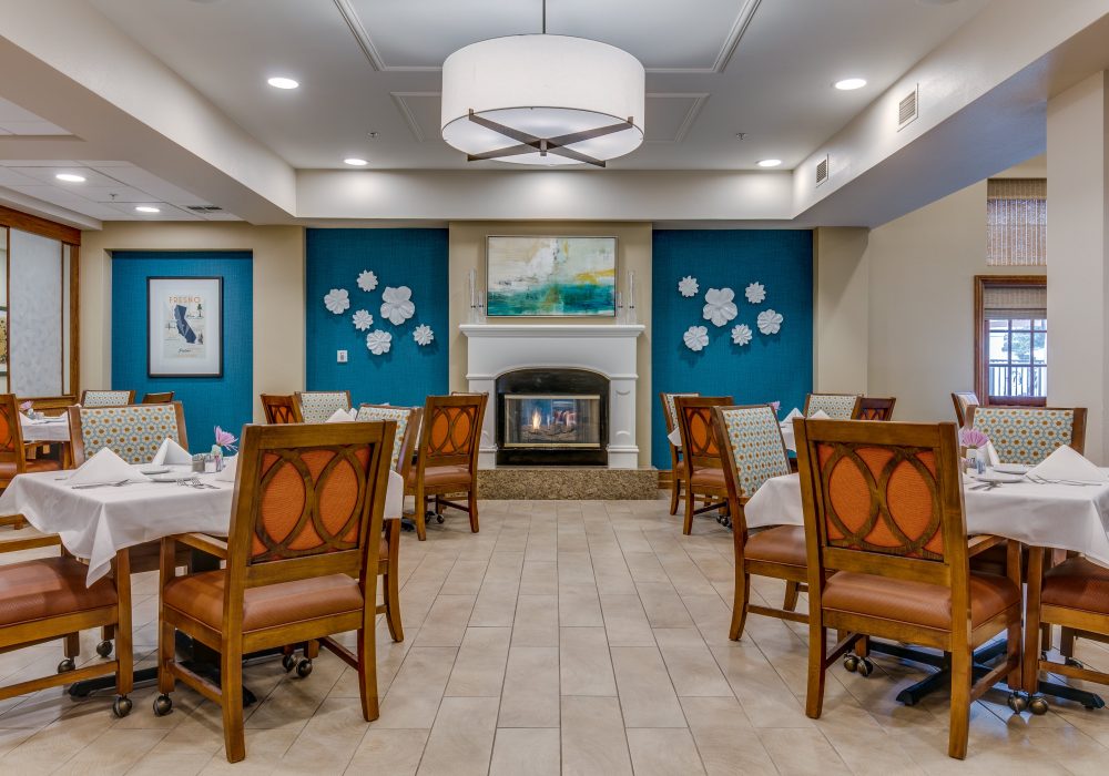Bright dining room with tables and decorative wall art