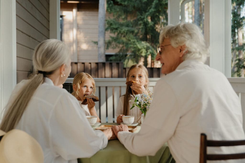 Residents enjoying snacks on a porch