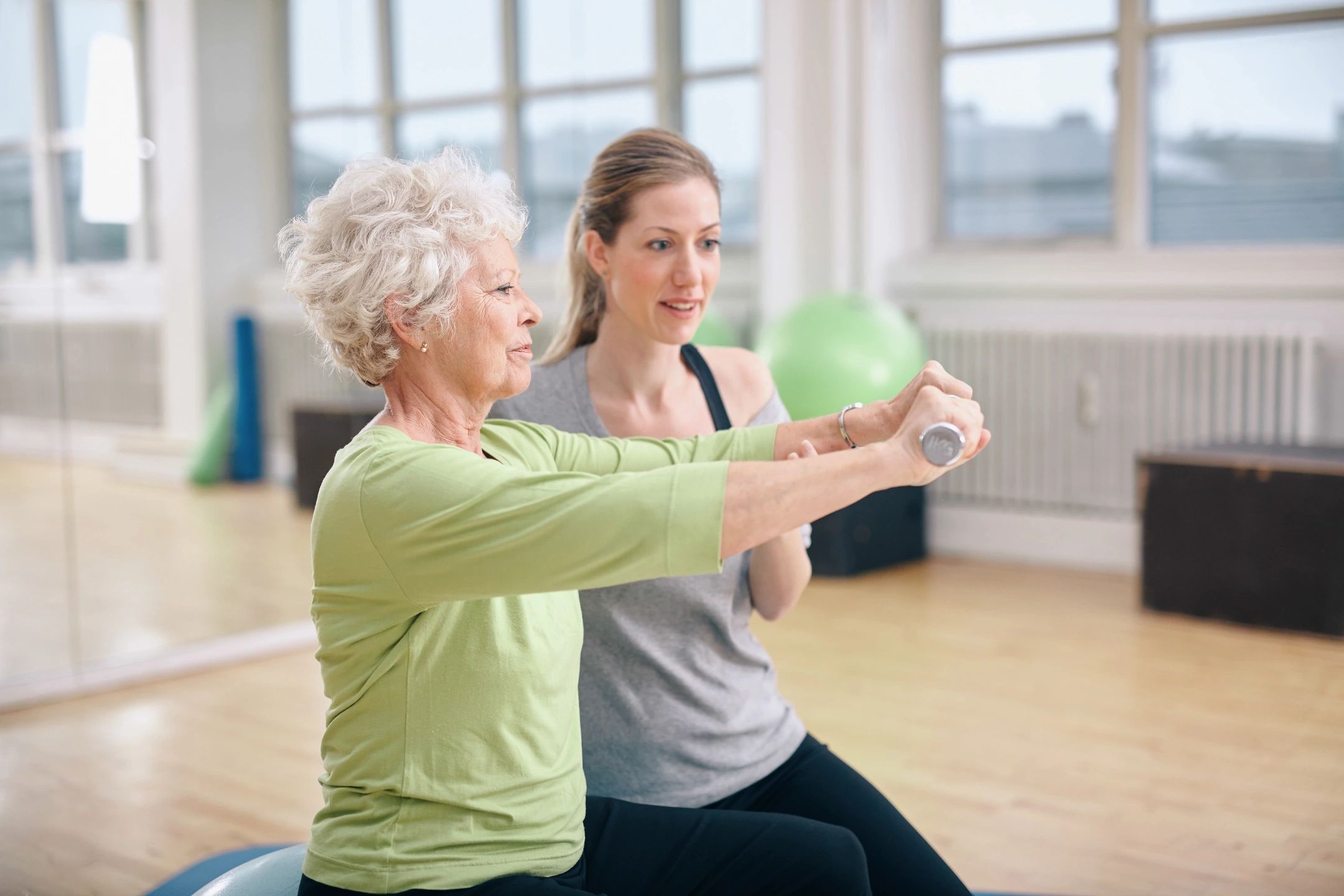Residents participating in an exercise session in a fitness room